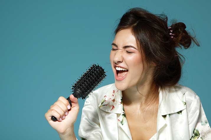 female-singing-hairbrush