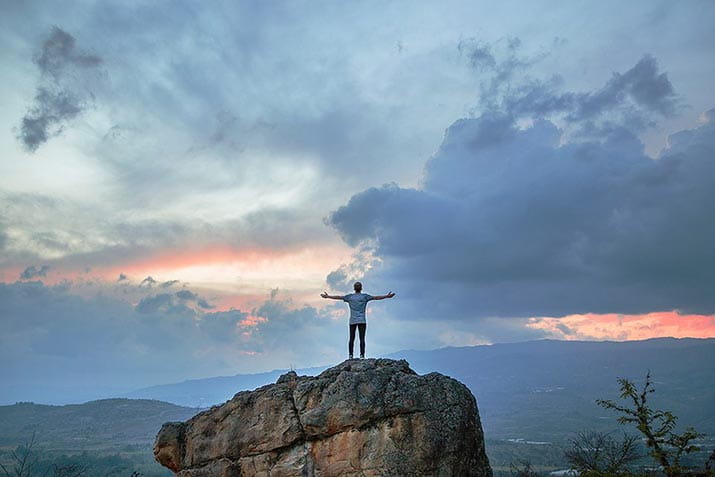 male-on-top-of-rock