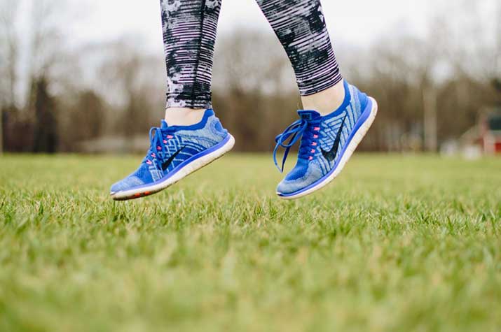 female exercising in the park