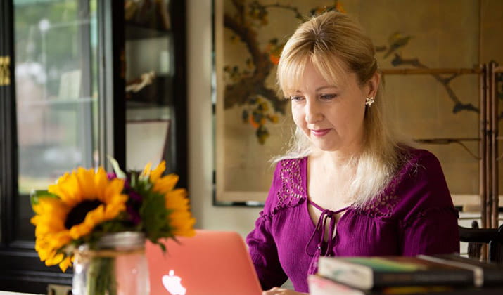 Student Sarah Jayne studying laptop