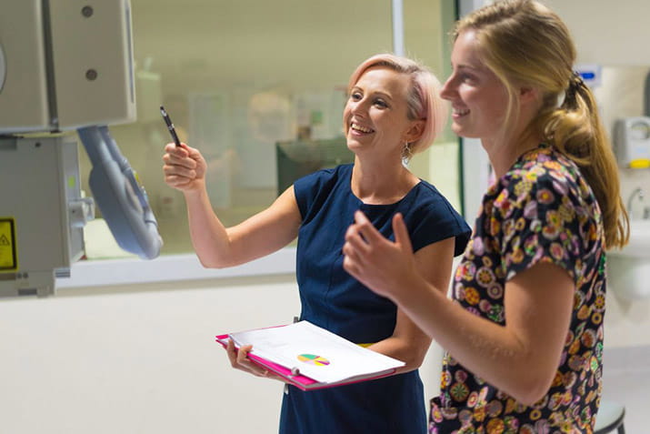 health-industry-management-student-brenda-working-with-staff