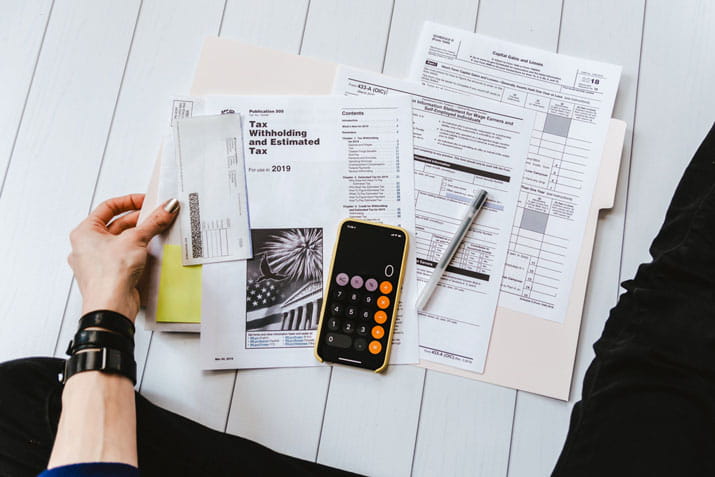 Female holding tax papers