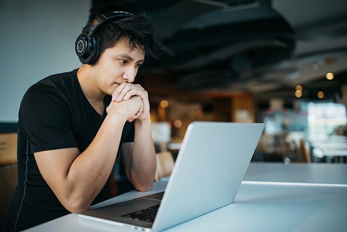 male-watching-on-laptop