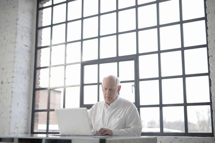 Elderly man at laptop