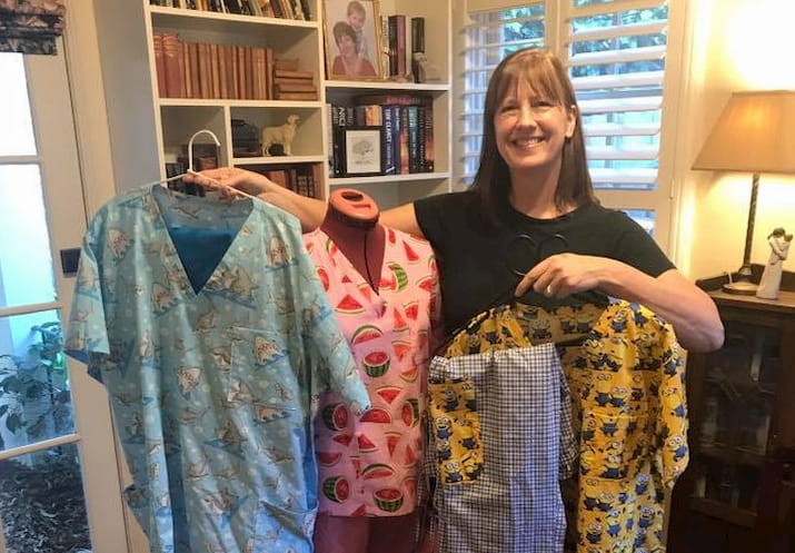Volunteer woman with hand-sewn scrubs