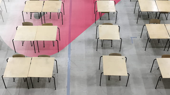 Desks setup for exam OUA logo