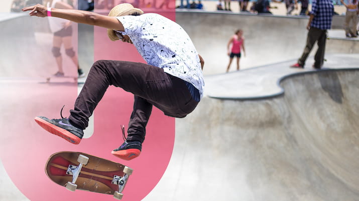 person doing trick on skateboard OUA logo