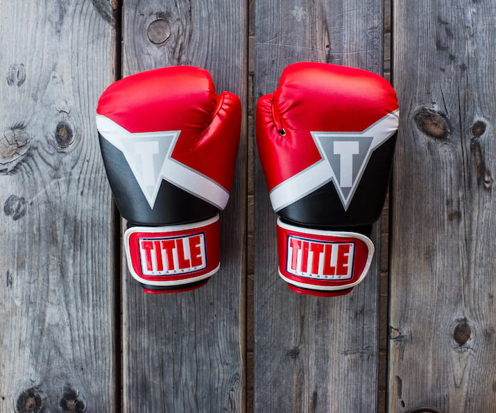 Two boxing gloves on table