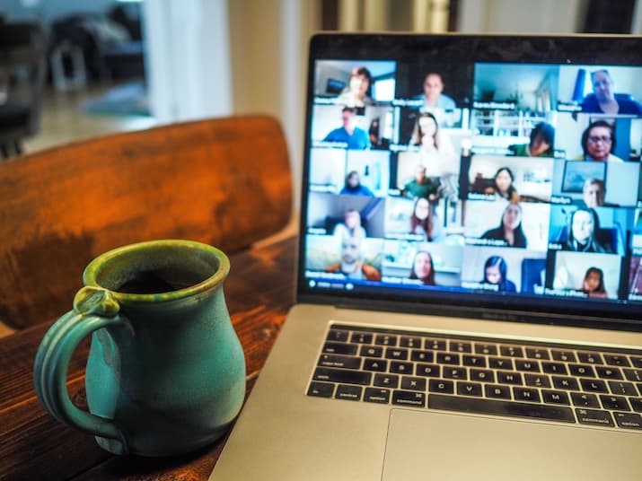 Laptop with video conference and coffee mug
