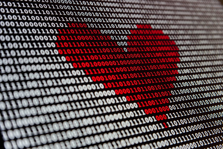 A red heart in binary code