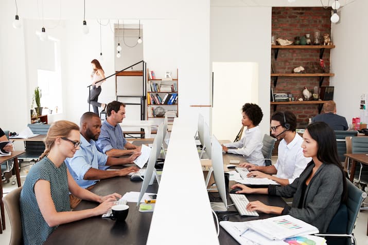 Colleagues in an open plan office