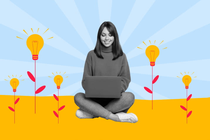 A woman sitting at her laptop surrounded by illustrated lightbulb flowers