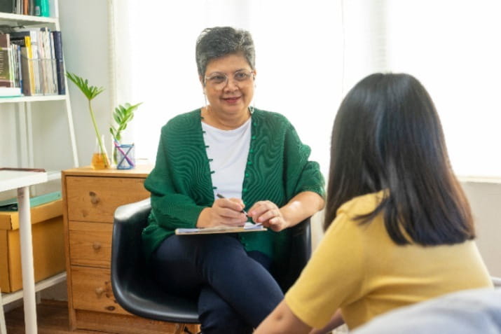 Woman with grey hair in professional setting