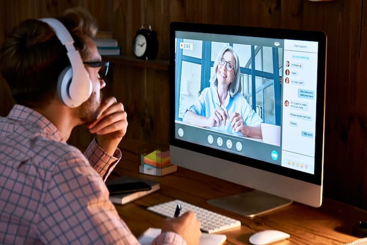 Man looking at screen with video call