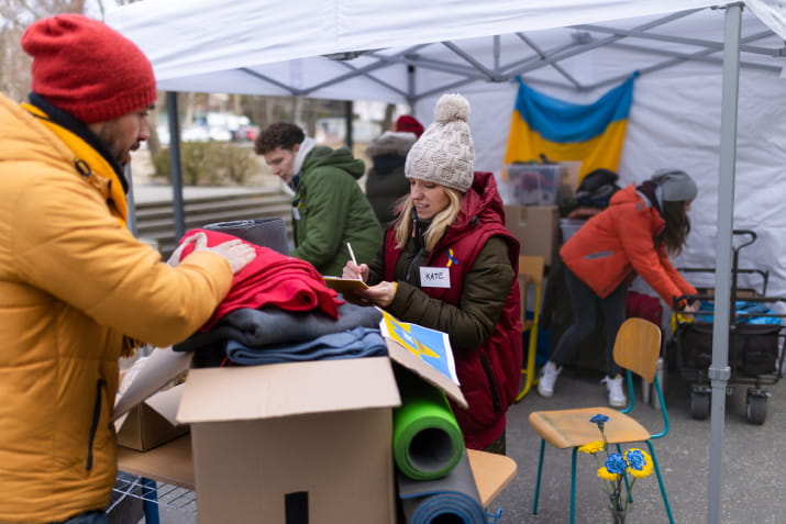 Volunteers sorting through clothing donations in Ukraine