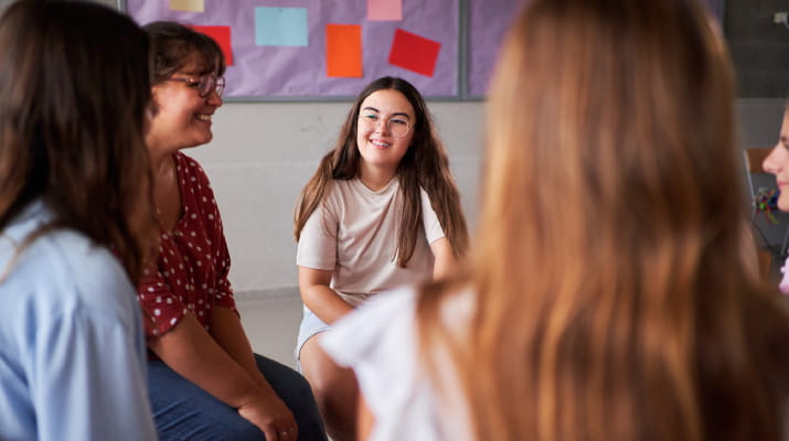 Happy children in a group session with a school counsellor