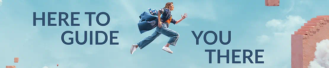 A student leaping from one side of a platform to another, with a blue sky in the background.