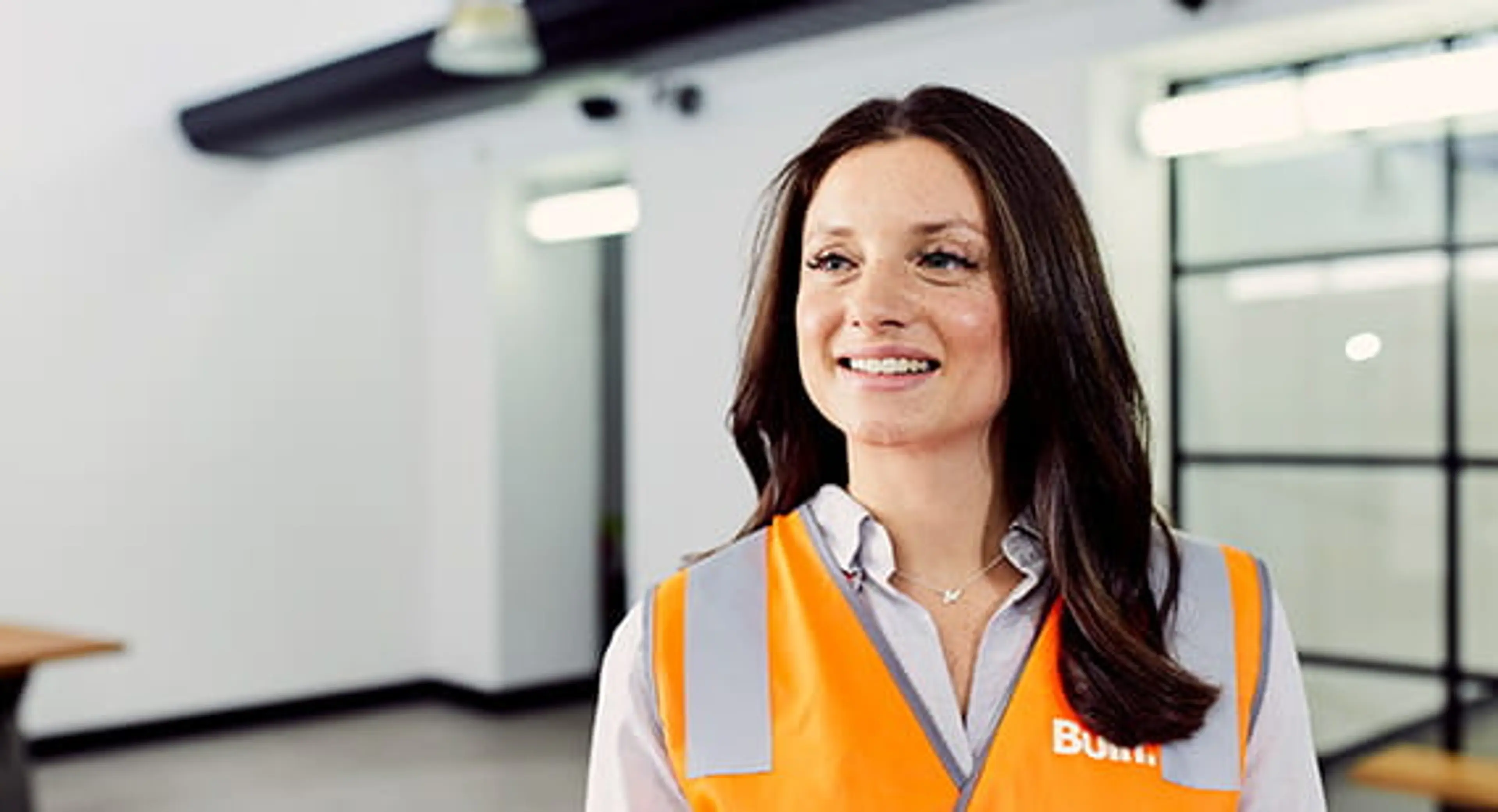 Open Universities Australia student, Christelle, wearing a high visibility vest.