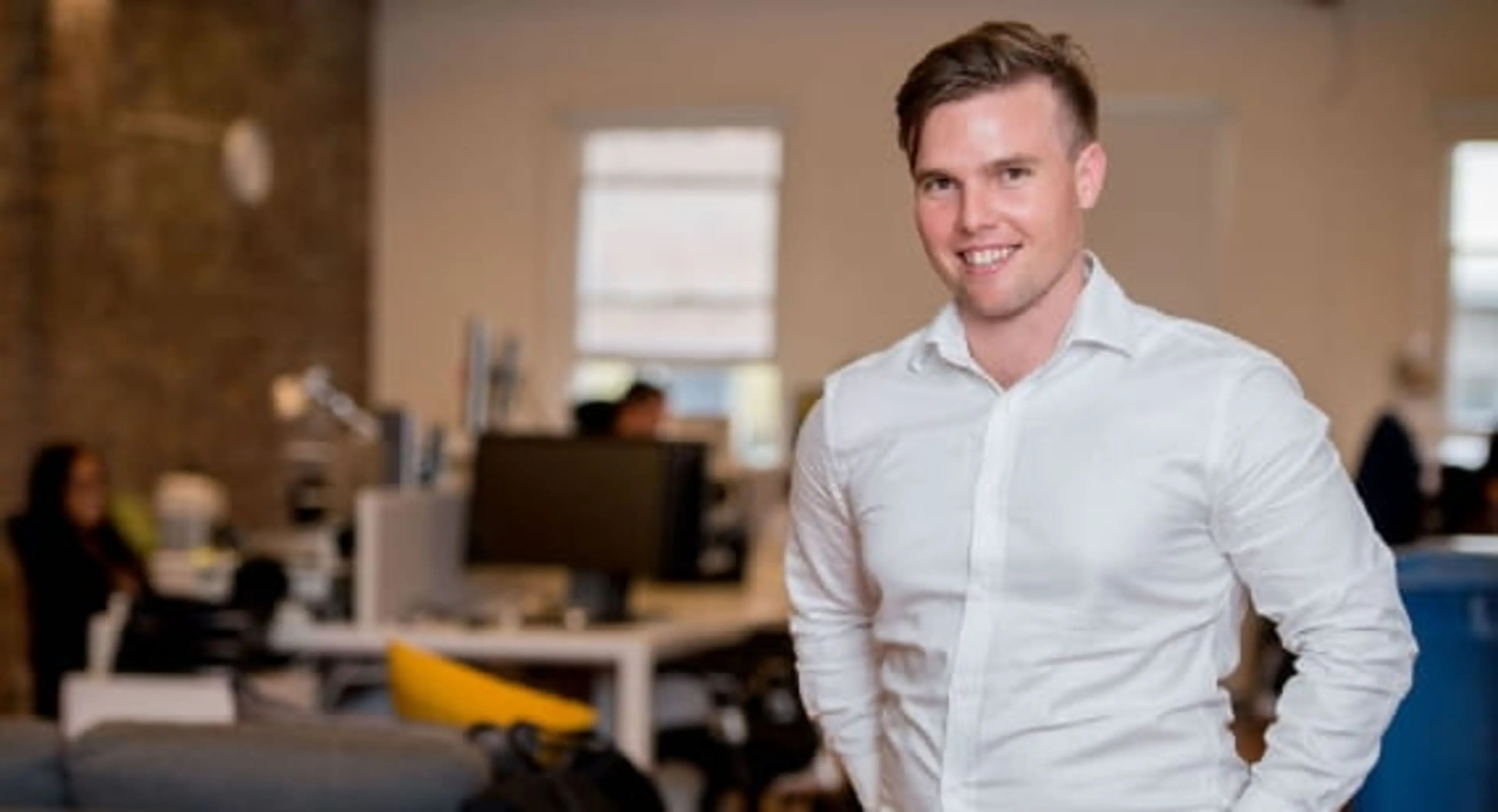 Accounting student, Steven, standing in a workplace