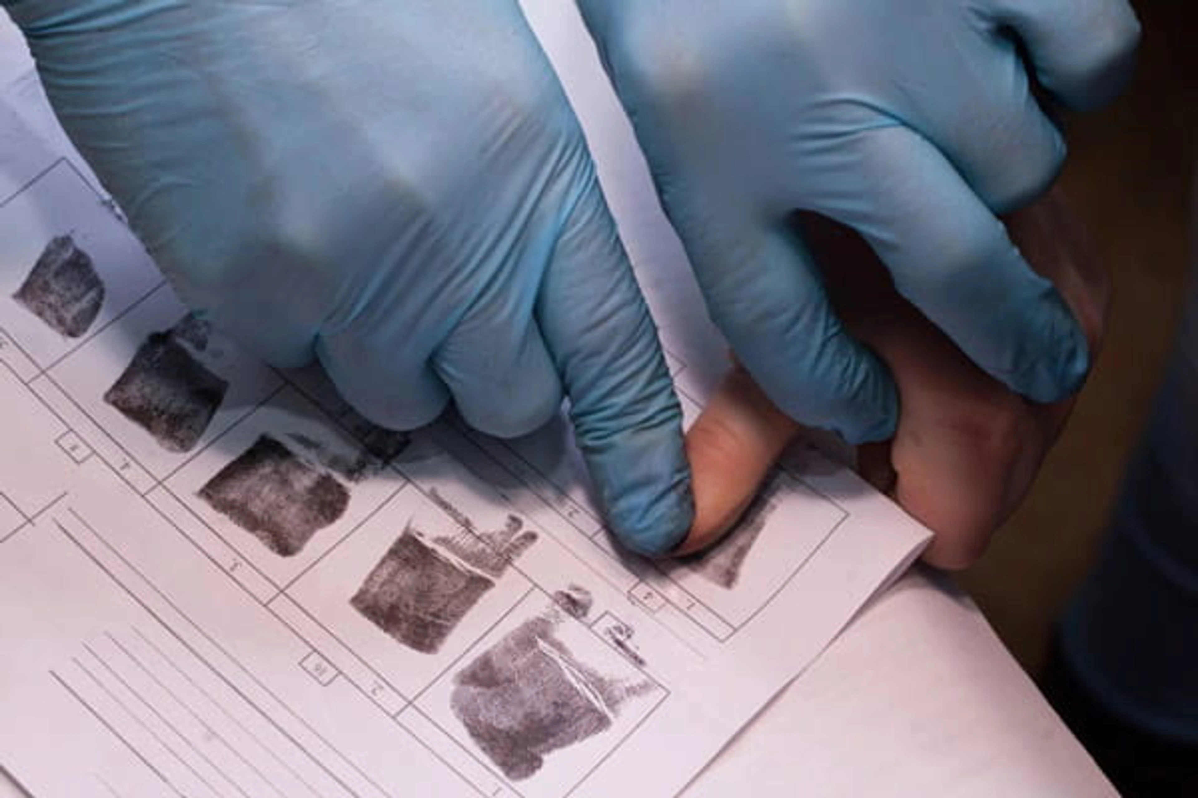 Fingerprint being recorded with ink