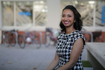 Open Universities Australia student Kelly wearing professional clothes in a business setting.