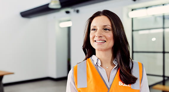 Open Universities Australia student, Christelle, wearing a high visibility vest.